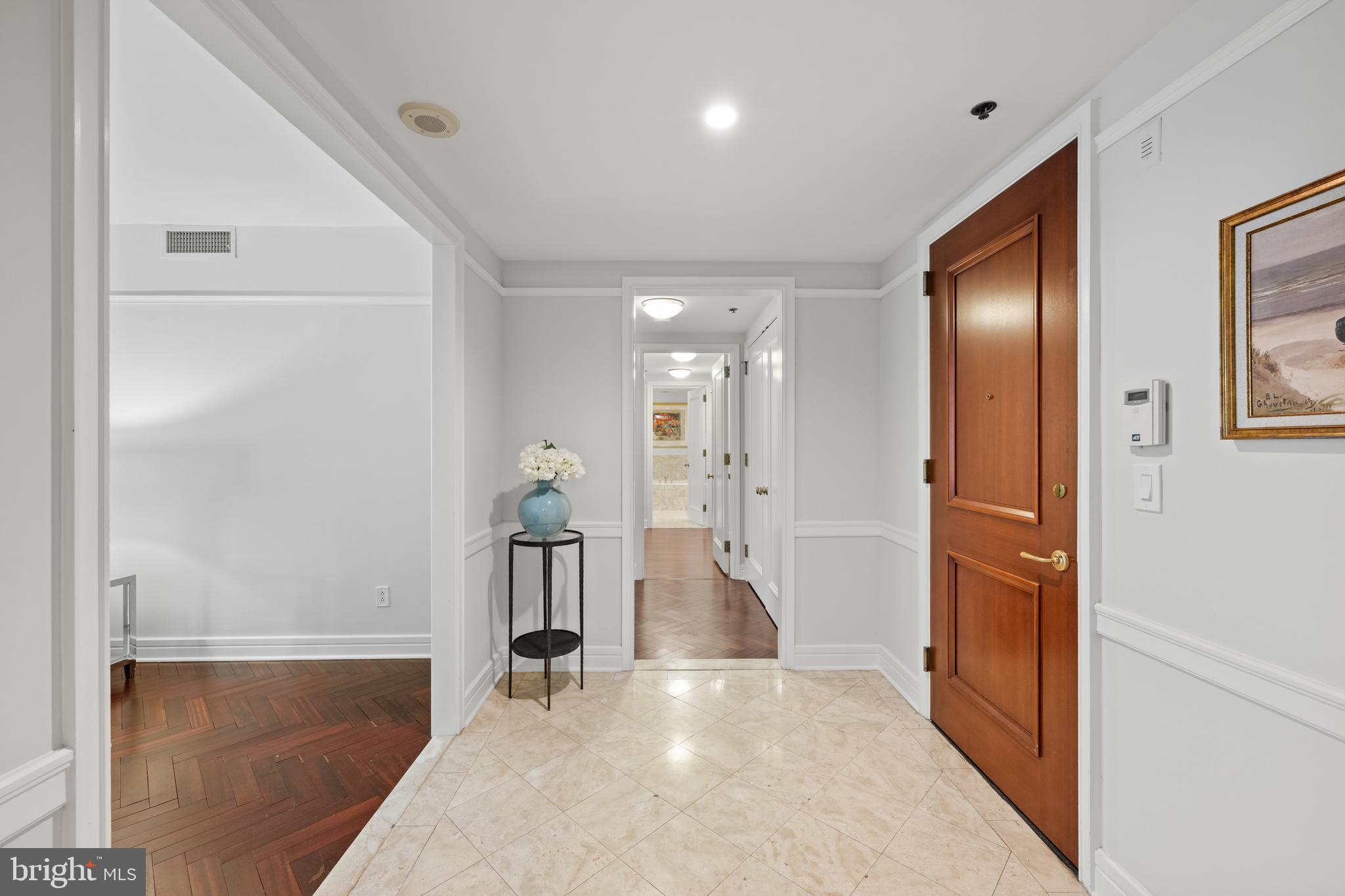 1155 23rd Street Northwest, Unit 6C Washington, DC 20037 - Photo 17 of 32 a view of a hallway with wooden floor and staircase