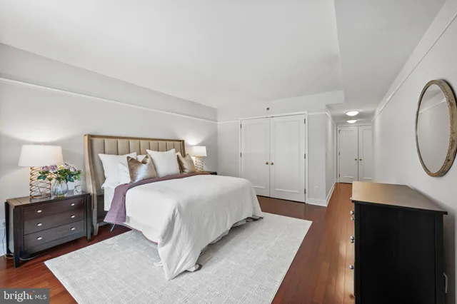 a bedroom with a bed and a dresser