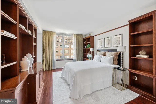 a bedroom with a bed and walk in closet