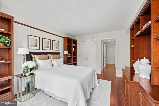 a bedroom with a bed and a couch