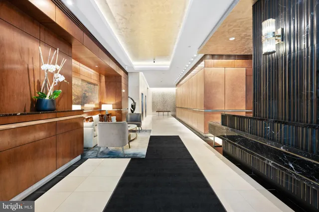 a view of a balcony with lots of potted plants