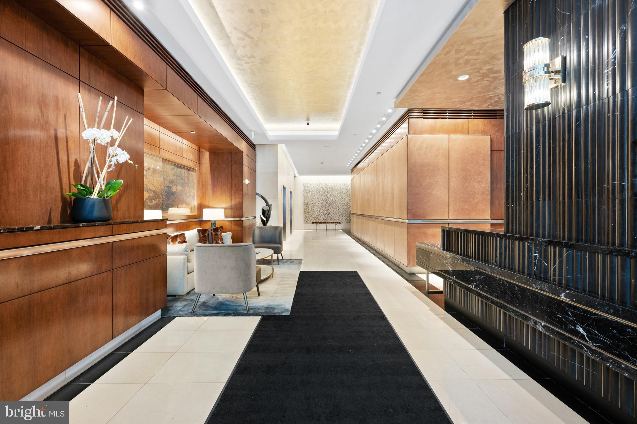 1155 23rd Street Northwest, Unit 6C Washington, DC 20037 - Photo 5 of 32 a view of a balcony with lots of potted plants