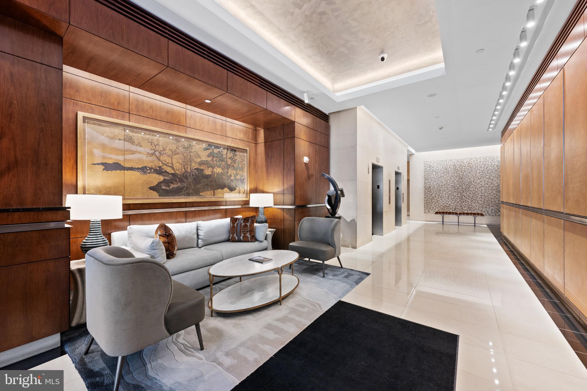 1155 23rd Street Northwest, Unit 6C Washington, DC 20037 - Photo 6 of 32 a living room with furniture and a large window