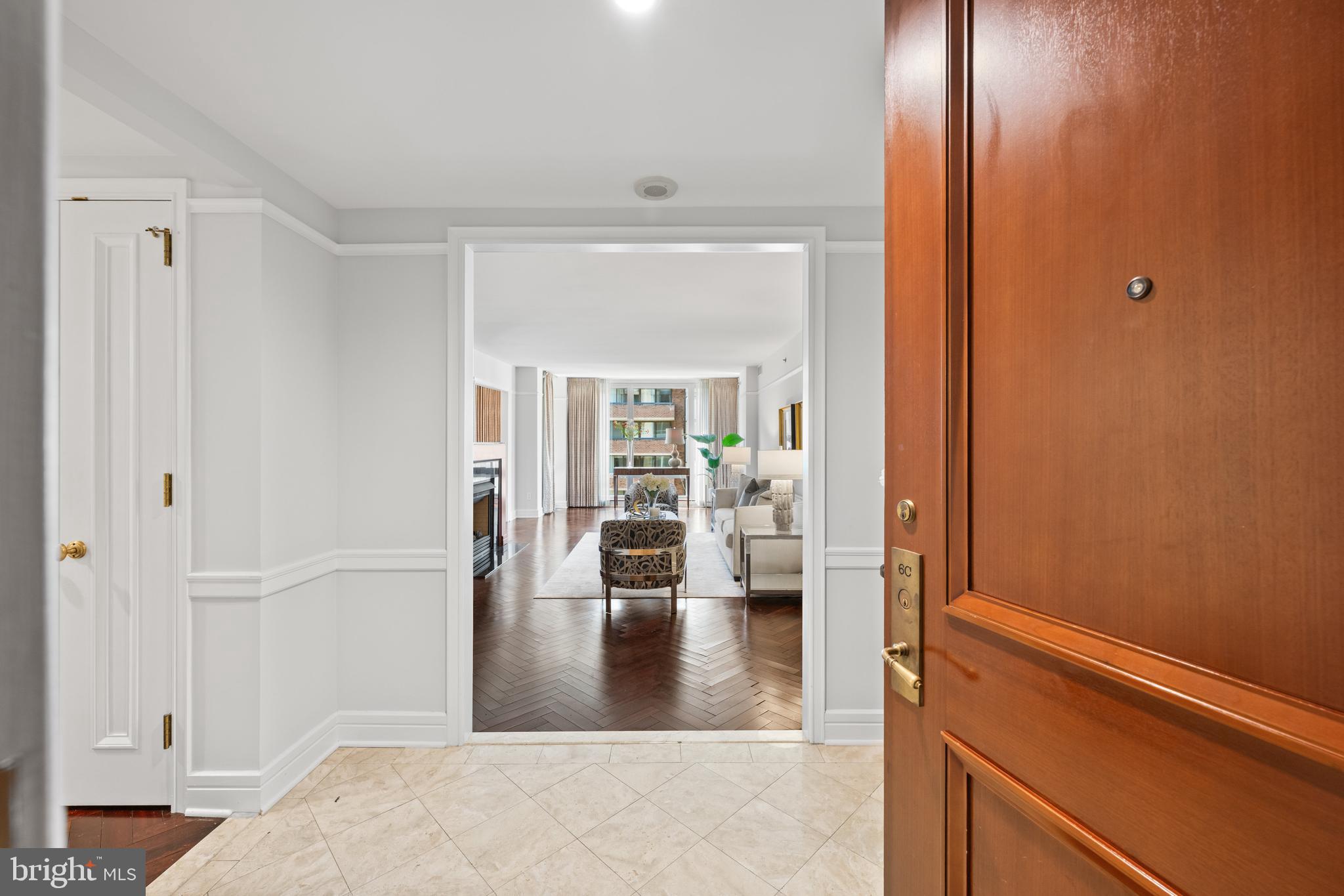 1155 23rd Street Northwest, Unit 6C Washington, DC 20037 - Photo 7 of 32 a view of livingroom with furniture and wooden floor