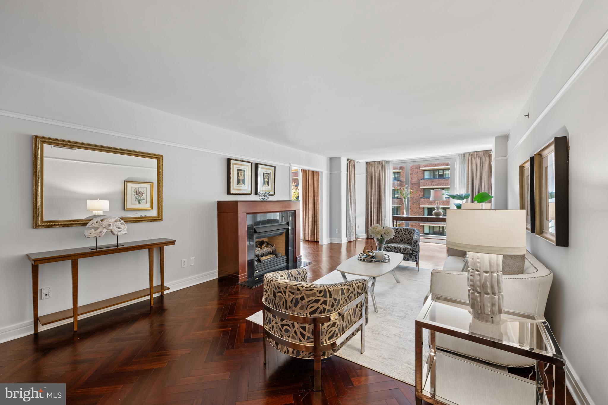 1155 23rd Street Northwest, Unit 6C Washington, DC 20037 - Photo 8 of 32 a living room with furniture or couch and a wooden floor