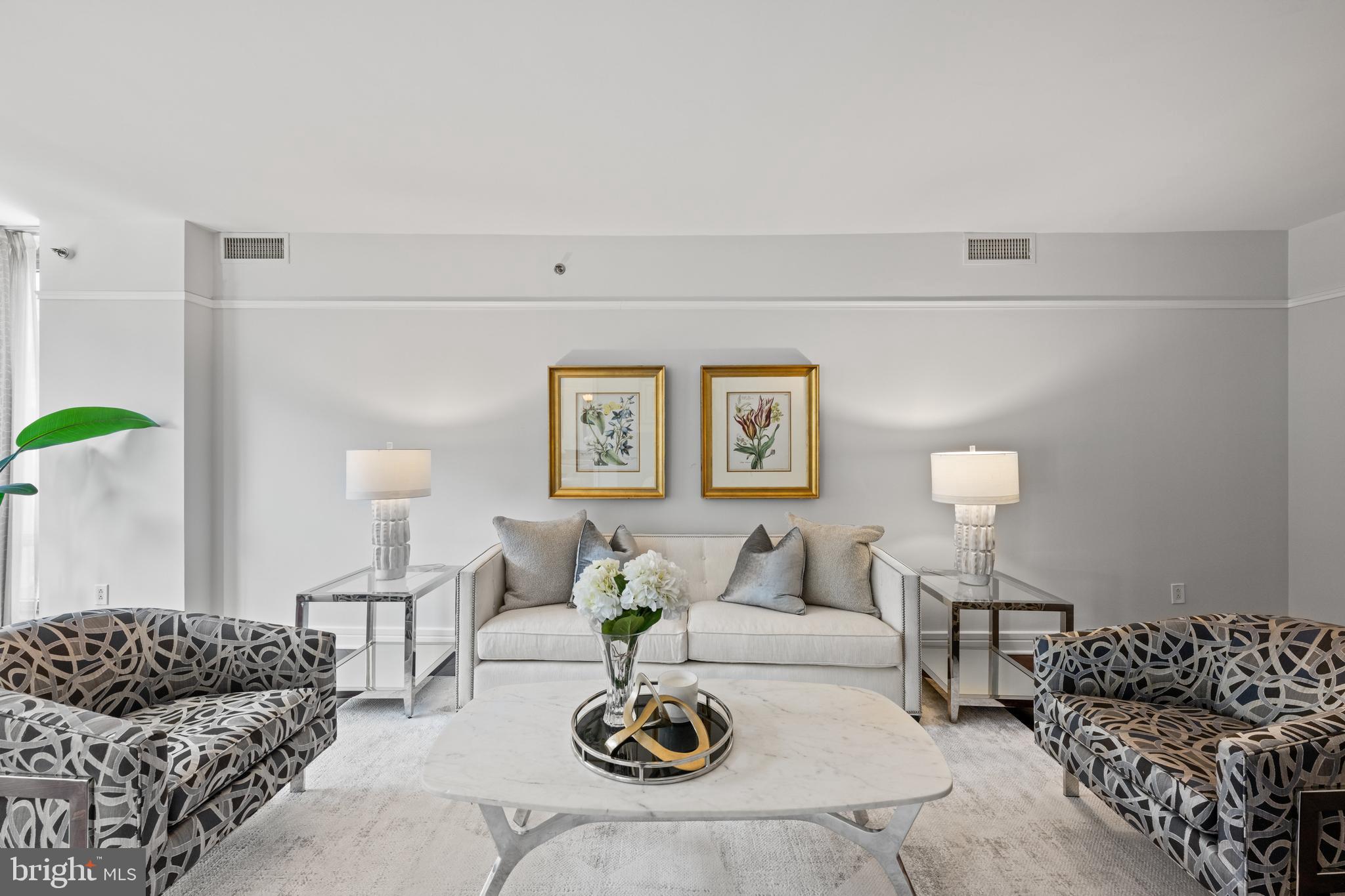 1155 23rd Street Northwest, Unit 6C Washington, DC 20037 - Photo 9 of 32 a living room with furniture and a couch