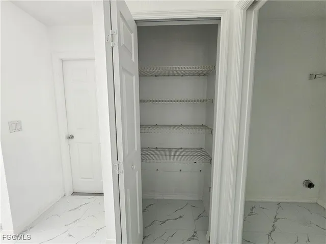 a view of an empty walk in closet