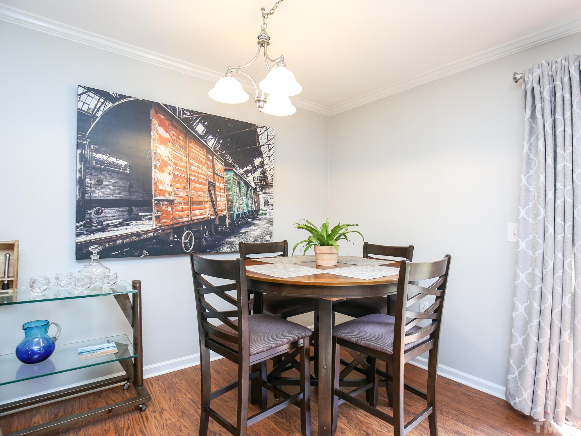 2429 Condor Court, Unit 2429 Raleigh, NC 27615 - Photo 12 of 26 a view of a dining room with furniture and window