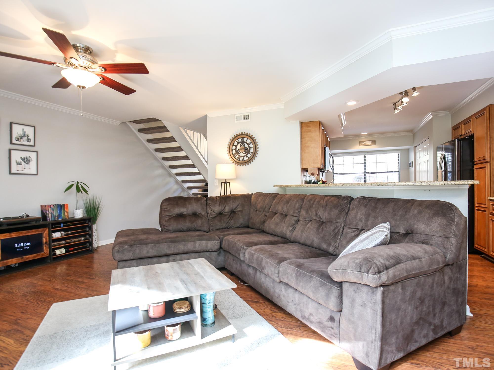 2429 Condor Court, Unit 2429 Raleigh, NC 27615 - Photo 2 of 26 a living room with furniture and a flat screen tv