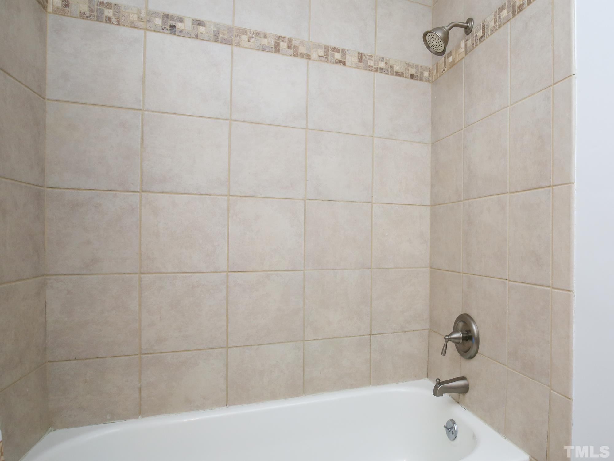2429 Condor Court, Unit 2429 Raleigh, NC 27615 - Photo 24 of 26 a bathroom with a bathtub