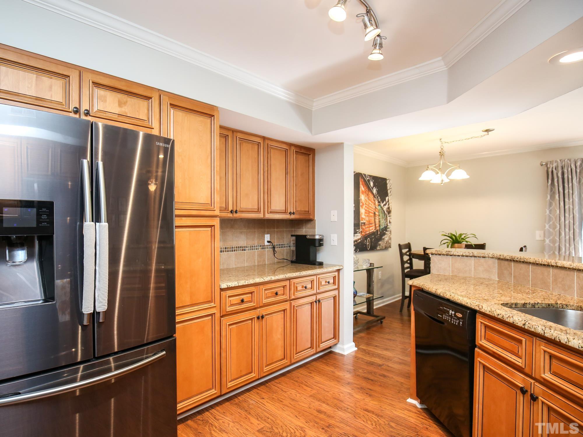 2429 Condor Court, Unit 2429 Raleigh, NC 27615 - Photo 8 of 26 a kitchen with a refrigerator sink and stove