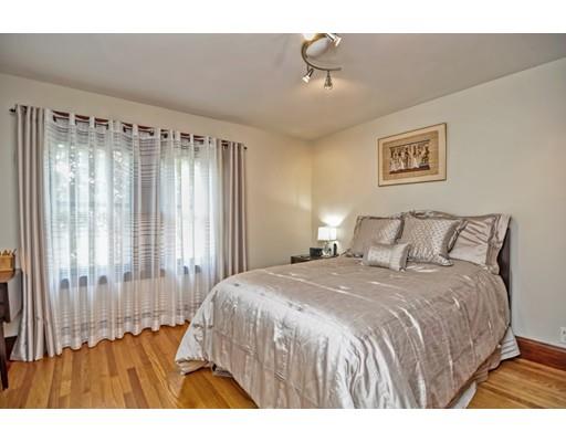 317 North Street Walpole, MA 02081 - Photo 20 of 27 a bedroom with a bed and a window