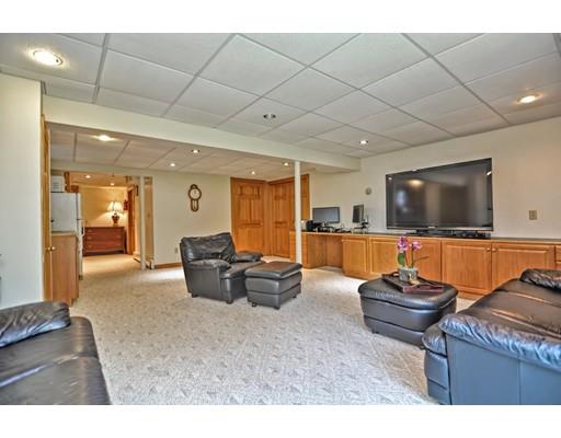 317 North Street Walpole, MA 02081 - Photo 26 of 27 a living room with furniture and a flat screen tv