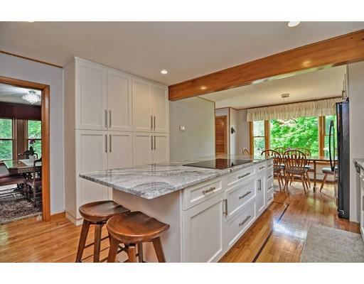 317 North Street Walpole, MA 02081 - Photo 6 of 27 a open kitchen with granite countertop sink and white cabinets