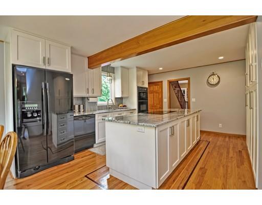 317 North Street Walpole, MA 02081 - Photo 8 of 27 a kitchen with stainless steel appliances a refrigerator and a stove