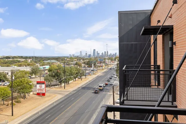 a view of a balcony with city view