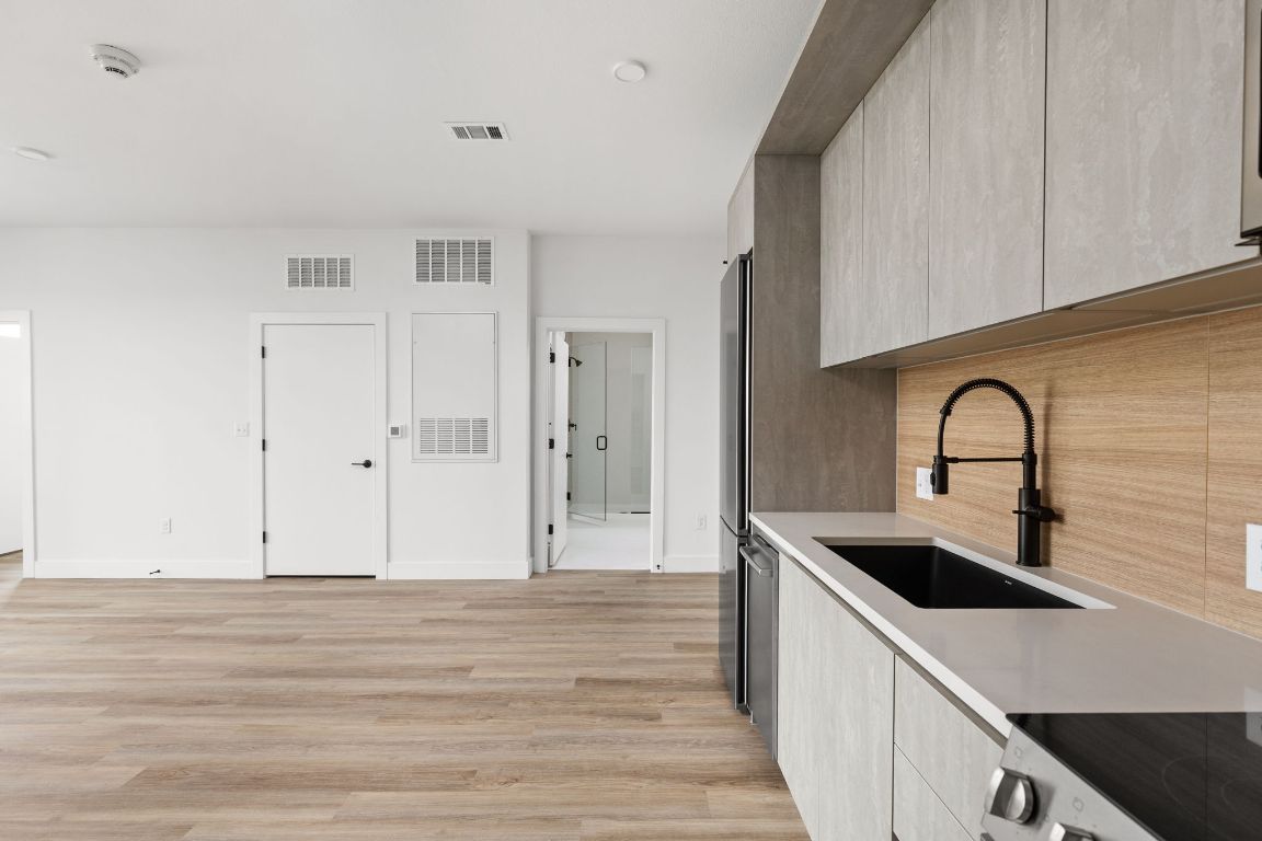 4315 South Congress Avenue, Unit 523 Austin, TX 78745 - Photo 5 of 32 a kitchen with a sink and cabinets