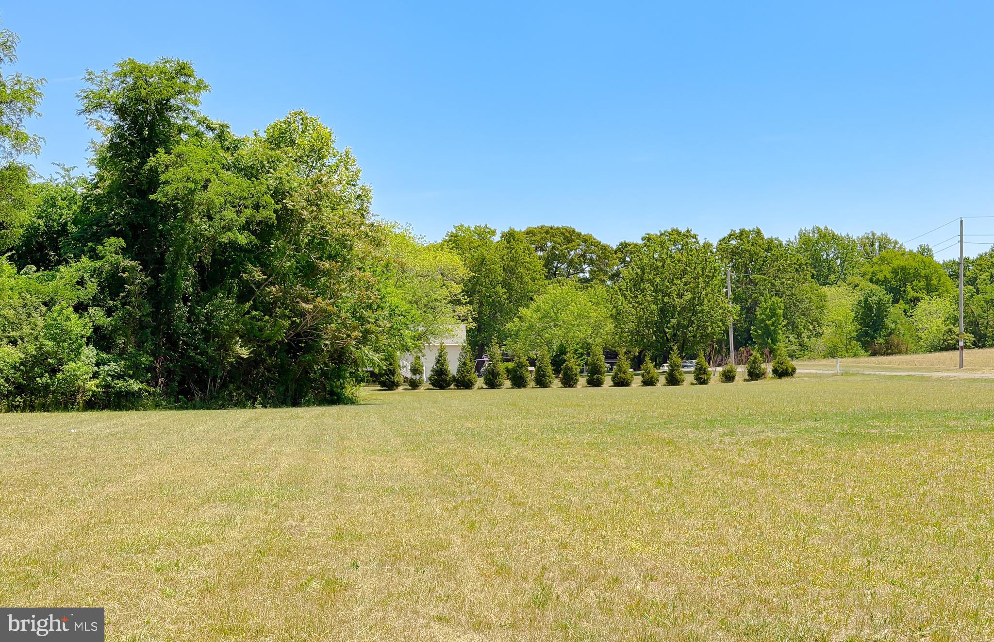 4985 Solomons Island Road Huntingtown, MD 20639 - Photo 45 of 50 a view of yard with trees in background