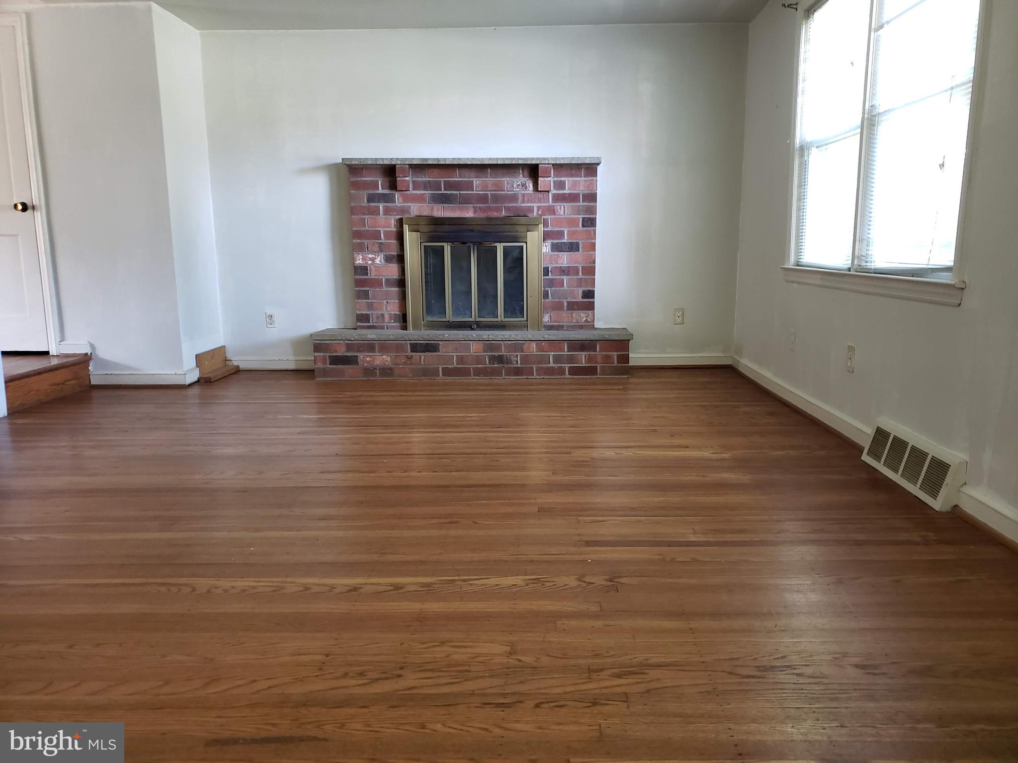 542 Valley View Road Springfield, PA 19064 - Photo 7 of 28 Living Room with Wood Burning Fireplace