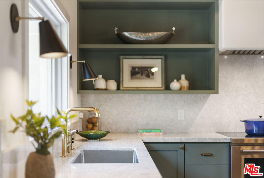 545 Del Oro Drive Ojai, CA 93023 - Photo 19 of 67 a kitchen with a sink and a stove top oven