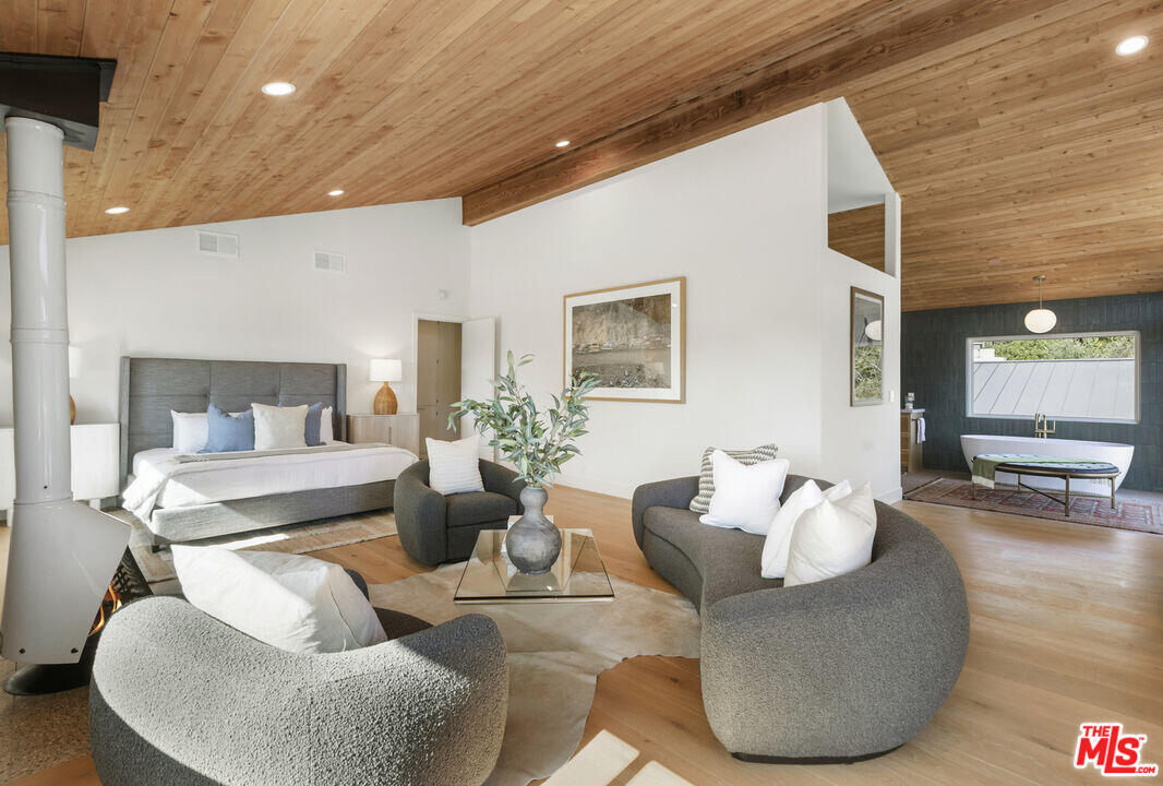 545 Del Oro Drive Ojai, CA 93023 - Photo 31 of 67 a living room with furniture and a wooden floor