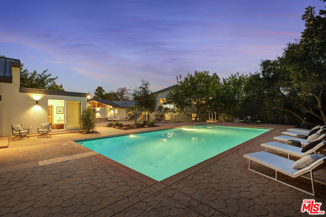 545 Del Oro Drive Ojai, CA 93023 - Photo 56 of 67 a view of a swimming pool and trees in the background