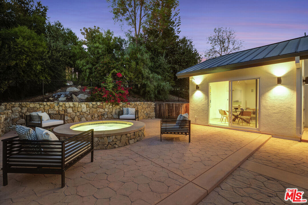 545 Del Oro Drive Ojai, CA 93023 - Photo 58 of 67 a view of a patio with a table and chairs and potted plants