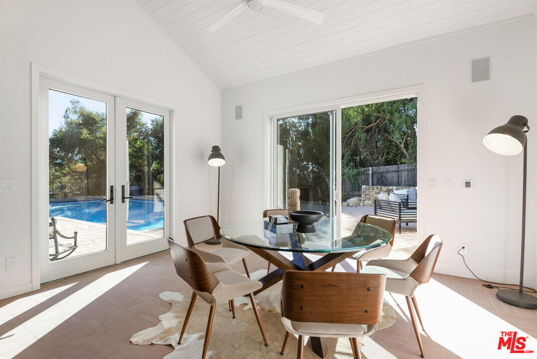 545 Del Oro Drive Ojai, CA 93023 - Photo 60 of 67 a view of a dining room with furniture wooden floor and a potted plant