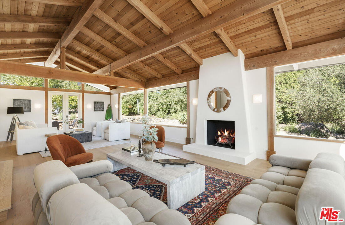 545 Del Oro Drive Ojai, CA 93023 - Photo 9 of 67 a living room with furniture a fireplace and a window