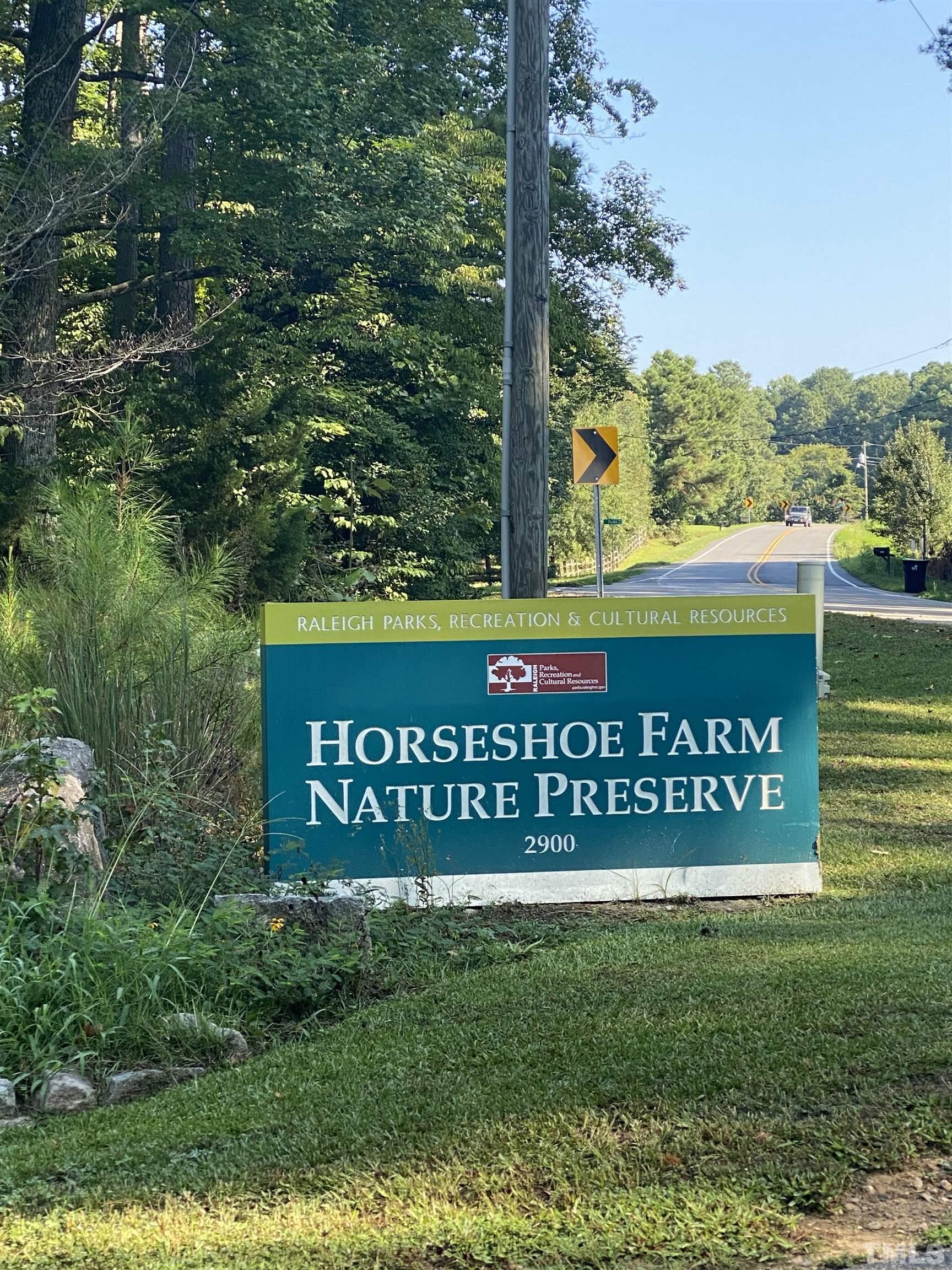 8224 Aldous Way Raleigh, NC 27616 - Photo 5 of 5 a sign on the side of the road
