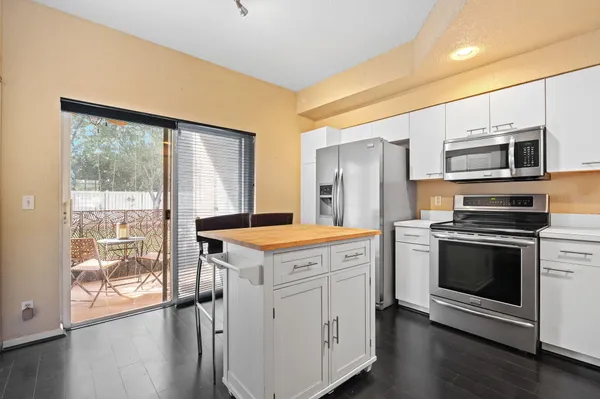a kitchen with a stove oven and a sink
