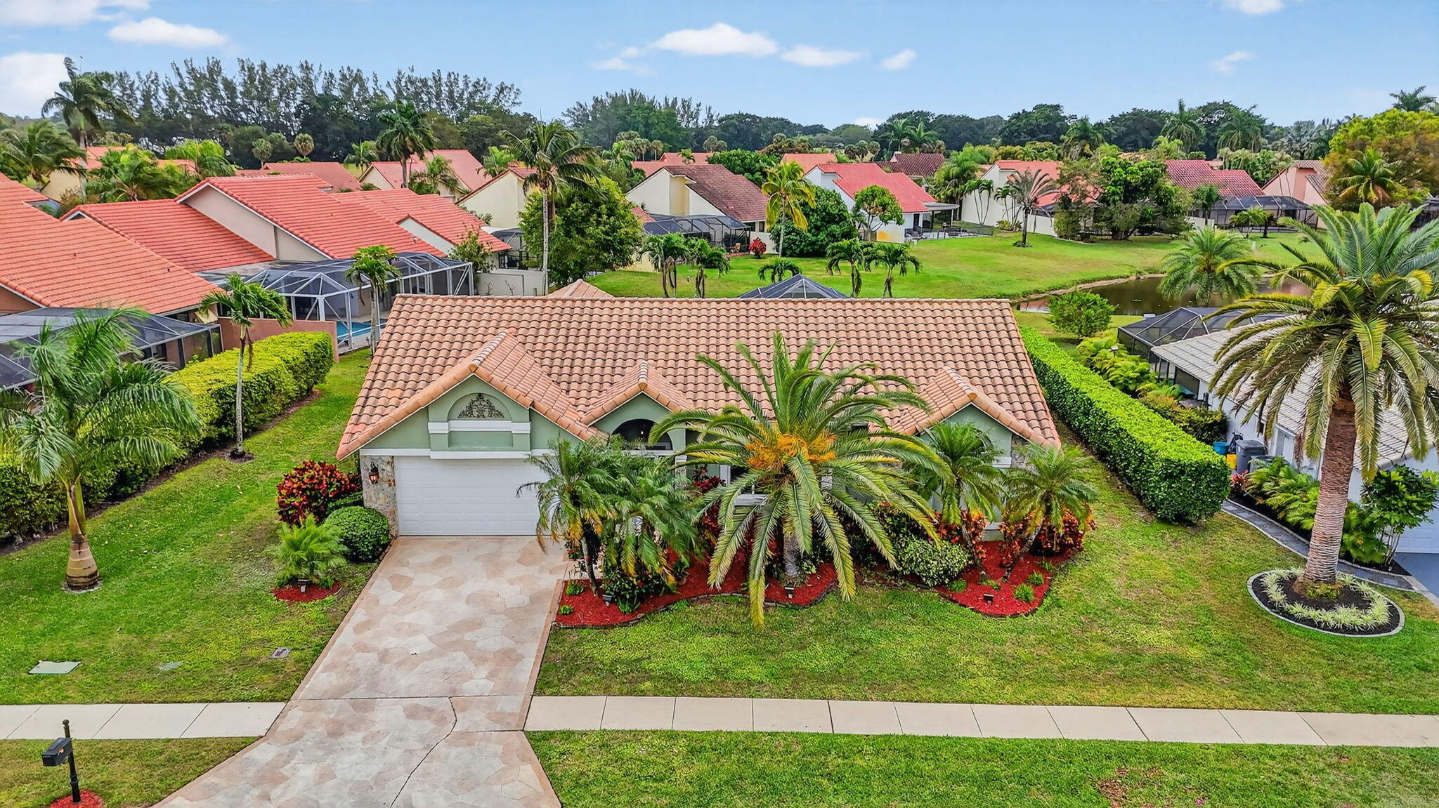 10194 Canoe Brook Circle Boca Raton, FL 33498 - Photo 1 of 42 an aerial view of residential houses with yard and lake view