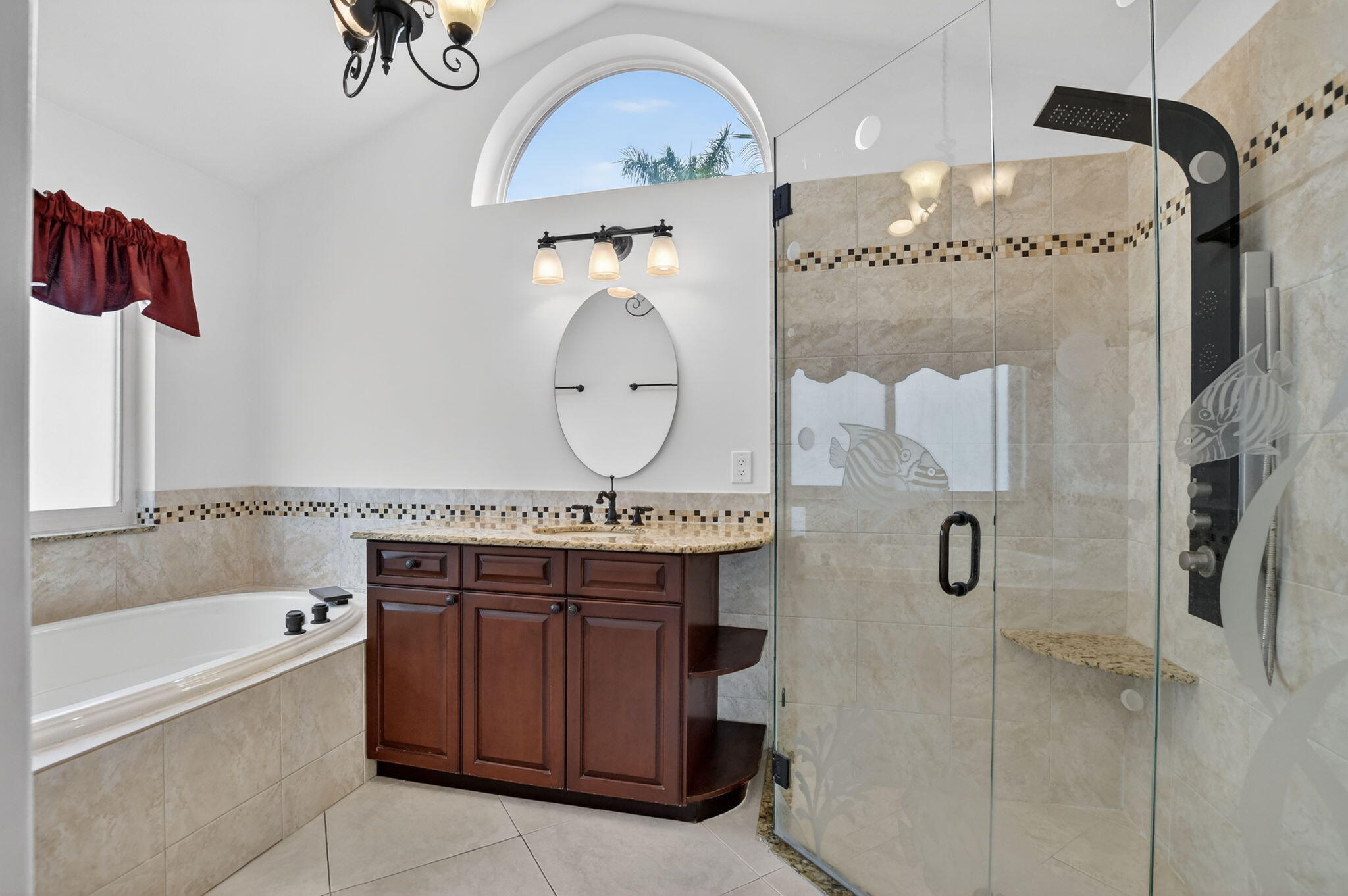 10194 Canoe Brook Circle Boca Raton, FL 33498 - Photo 15 of 42 a bathroom with a sink mirror vanity and bathtub