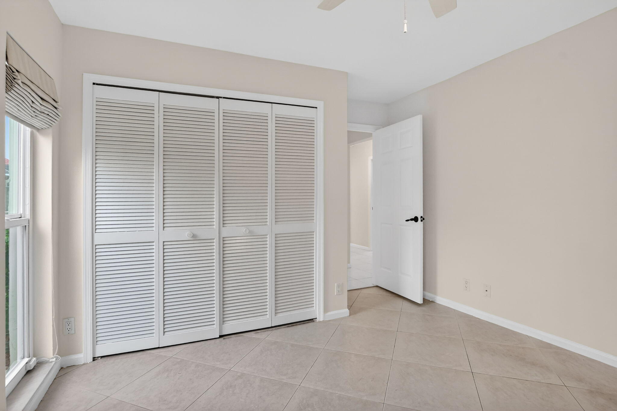 10194 Canoe Brook Circle Boca Raton, FL 33498 - Photo 23 of 42 an empty room with windows