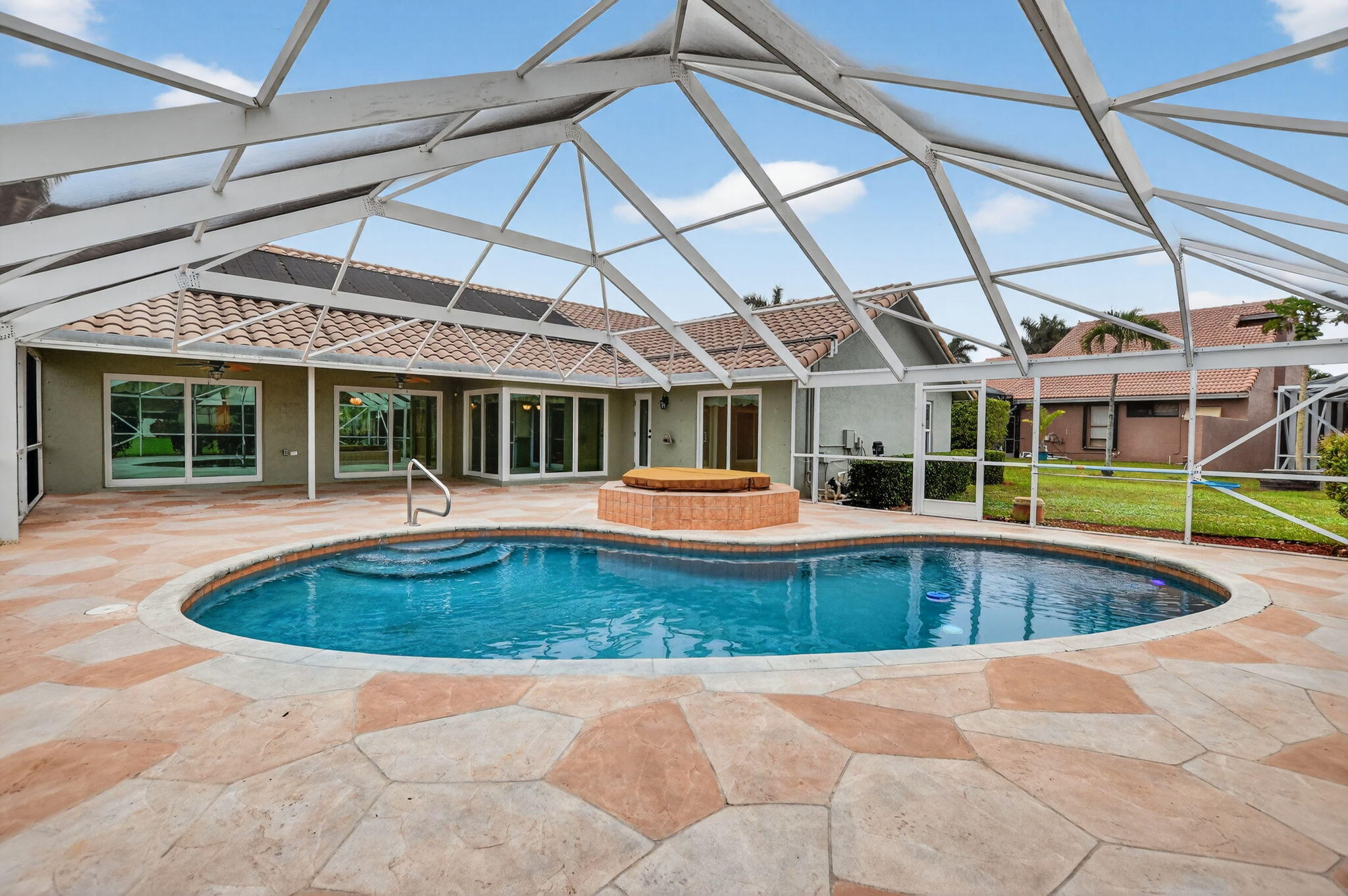 10194 Canoe Brook Circle Boca Raton, FL 33498 - Photo 34 of 42 a view of a swimming pool with a patio