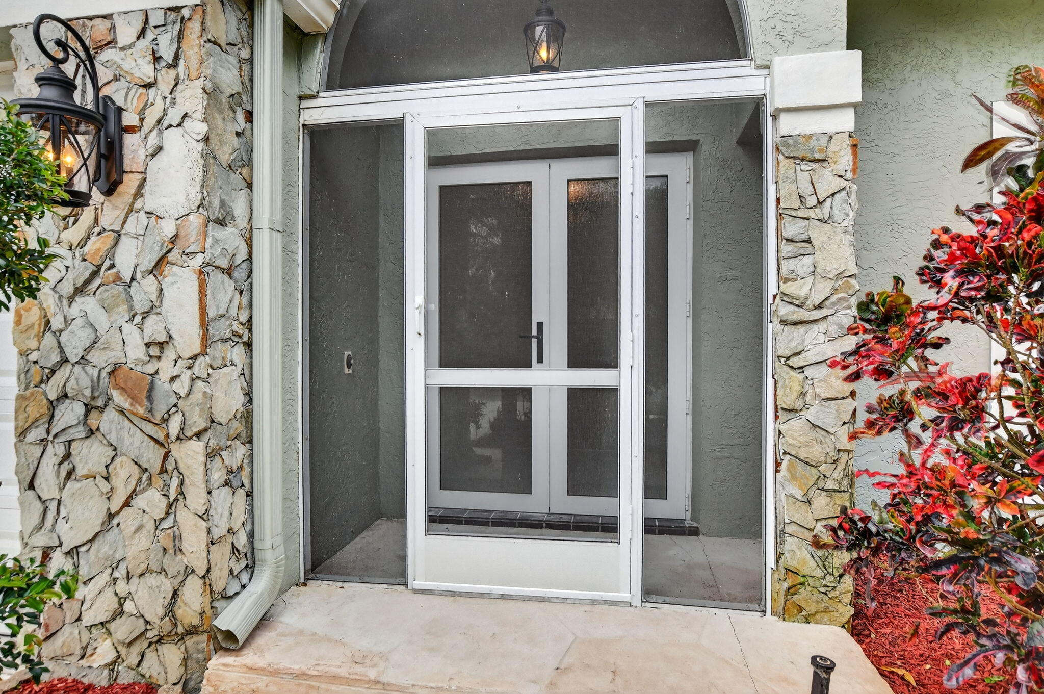 10194 Canoe Brook Circle Boca Raton, FL 33498 - Photo 7 of 42 front view of a house with a potted plant