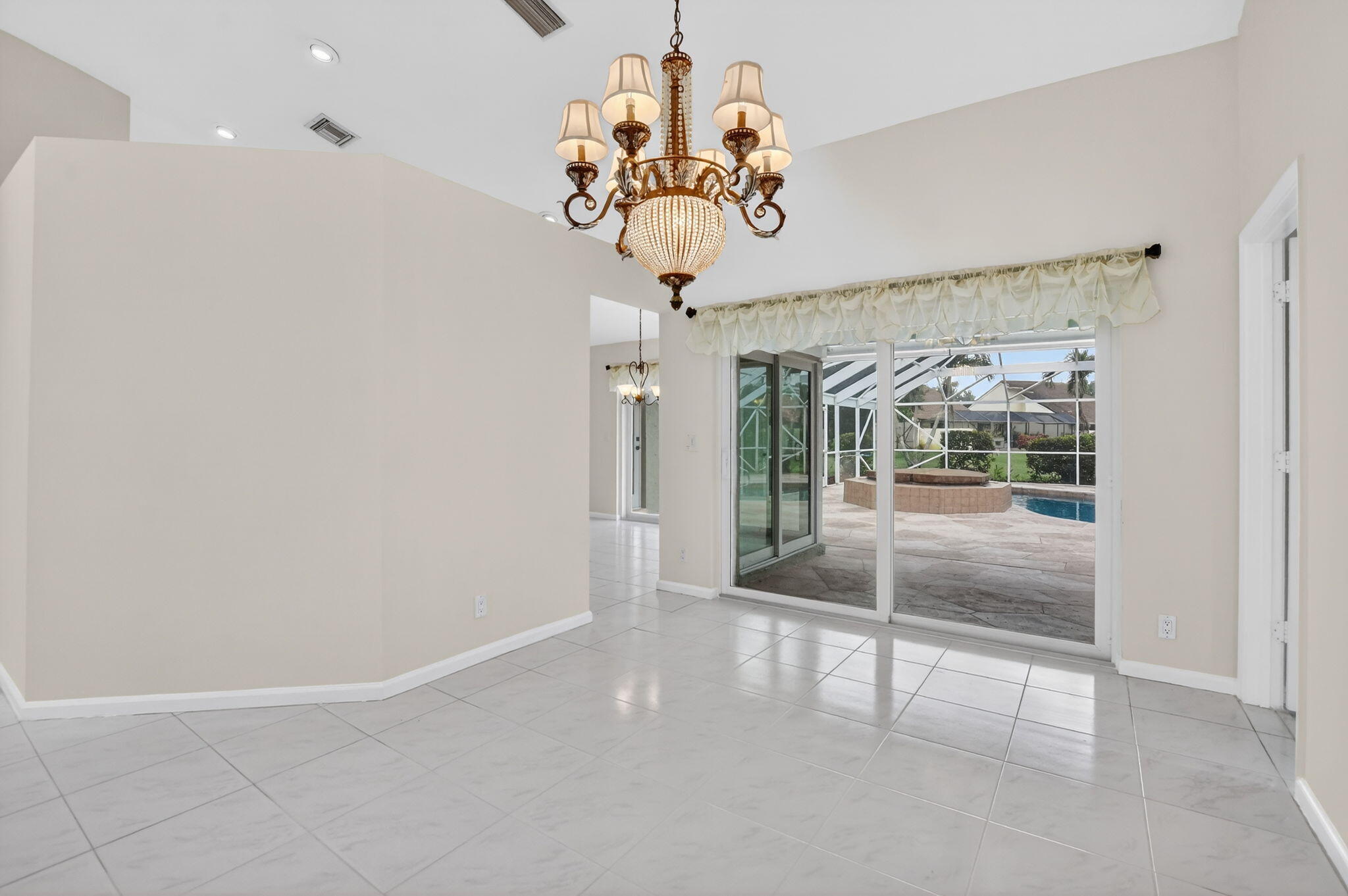 10194 Canoe Brook Circle Boca Raton, FL 33498 - Photo 10 of 42 a view of a hallway with a chandelier