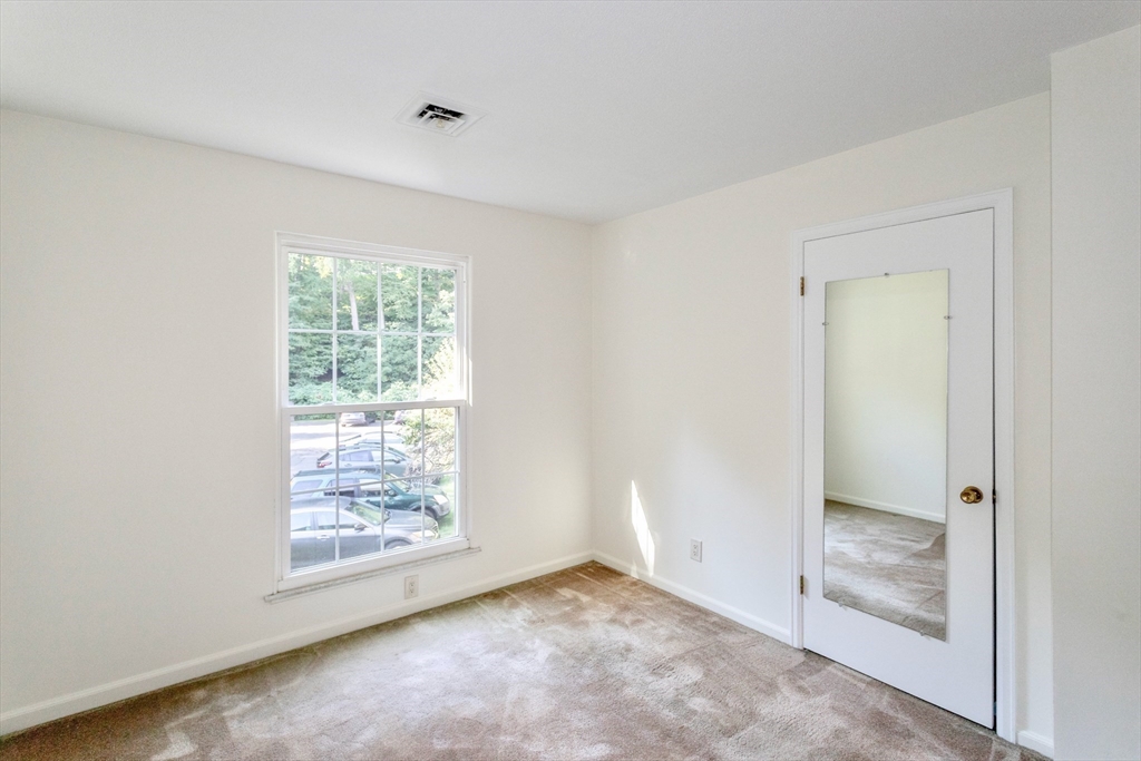 324 Russell Road, Unit 204 Westfield, MA 01085 - Photo 15 of 31 an empty room with windows