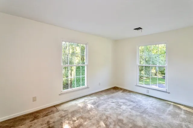 an empty room with windows