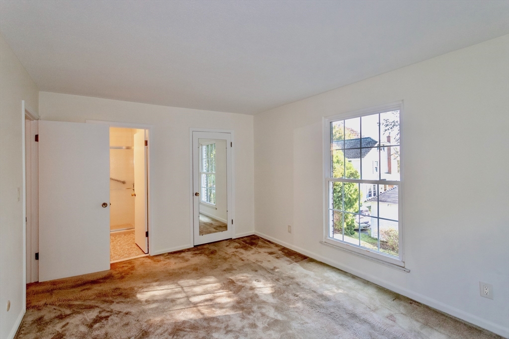 324 Russell Road, Unit 204 Westfield, MA 01085 - Photo 20 of 31 an empty room with windows