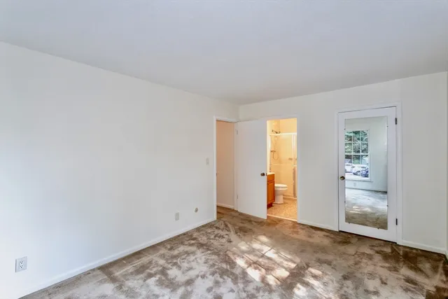 an empty room with closet area