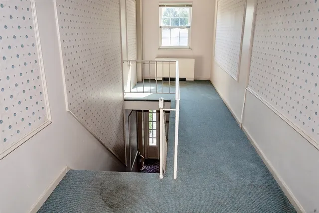 a bed room with furniture and a window