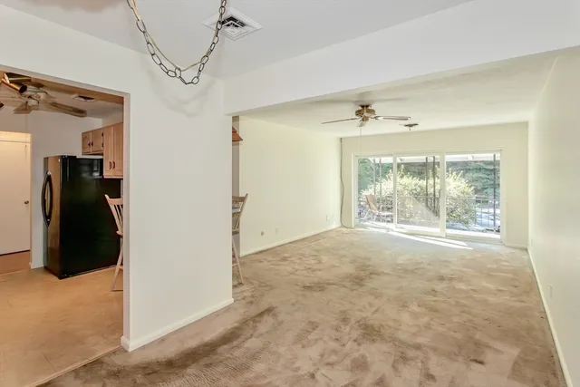 a view of a room with a walk in closet and a window