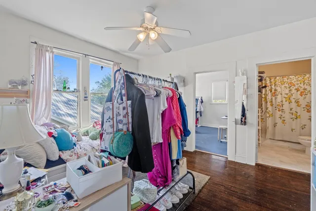 a view of a room with lots of stuff and hardwood floor