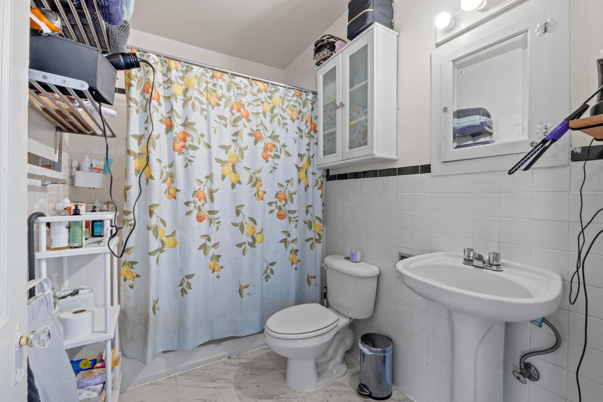 4014 Avenue D Austin, TX 78751 - Photo 18 of 34 a bathroom with a sink toilet and shower