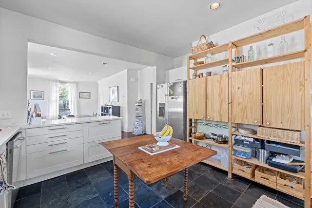 a room with furniture pool table and flat screen tv