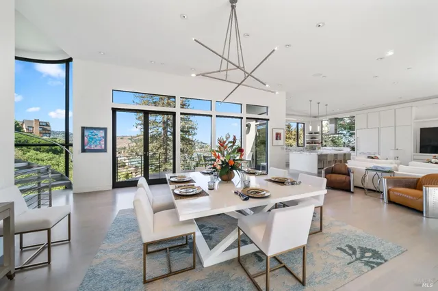 a dining table with chairs and window