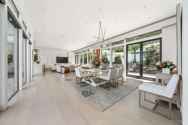 a kitchen with kitchen island granite countertop a sink a counter top space appliances and cabinets