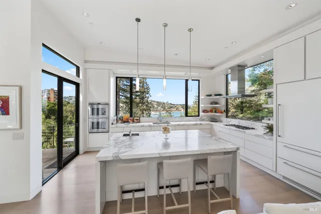 a balcony with chairs and table