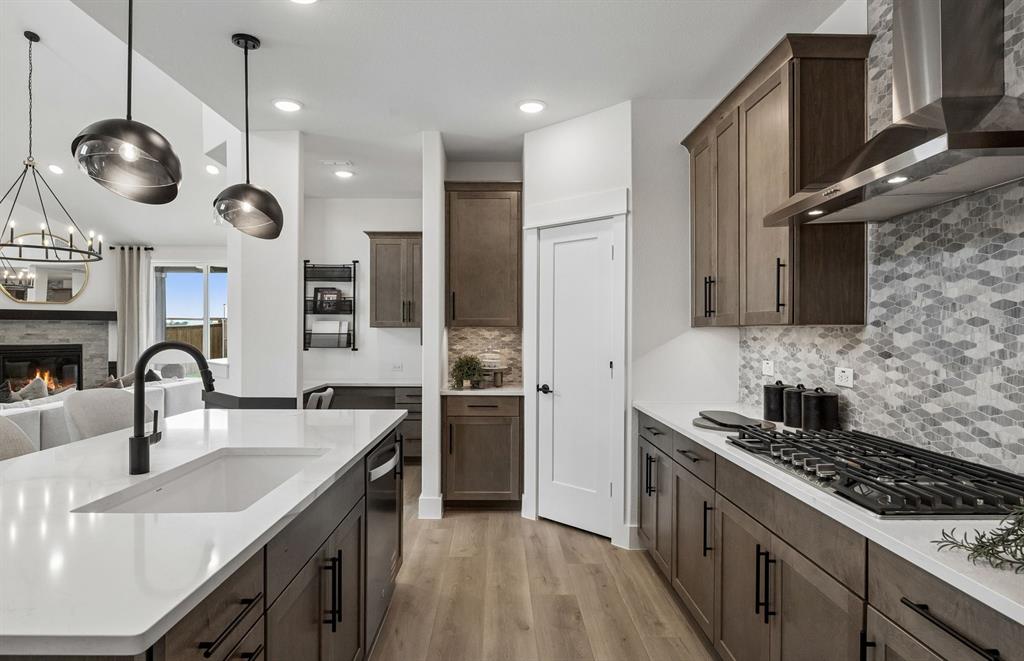 *Model Representation - Large island overlooking gathering room and dining areas
